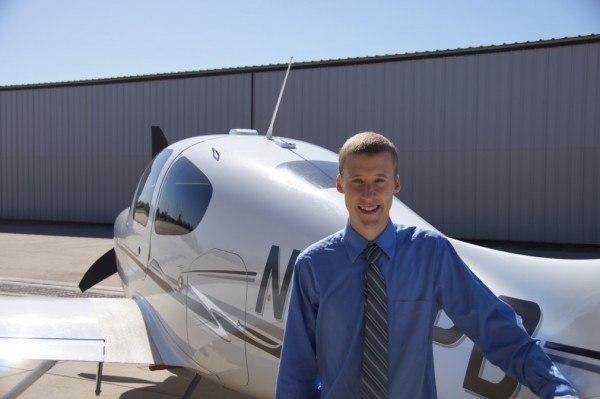 Hank in front of a Cirrus SR22