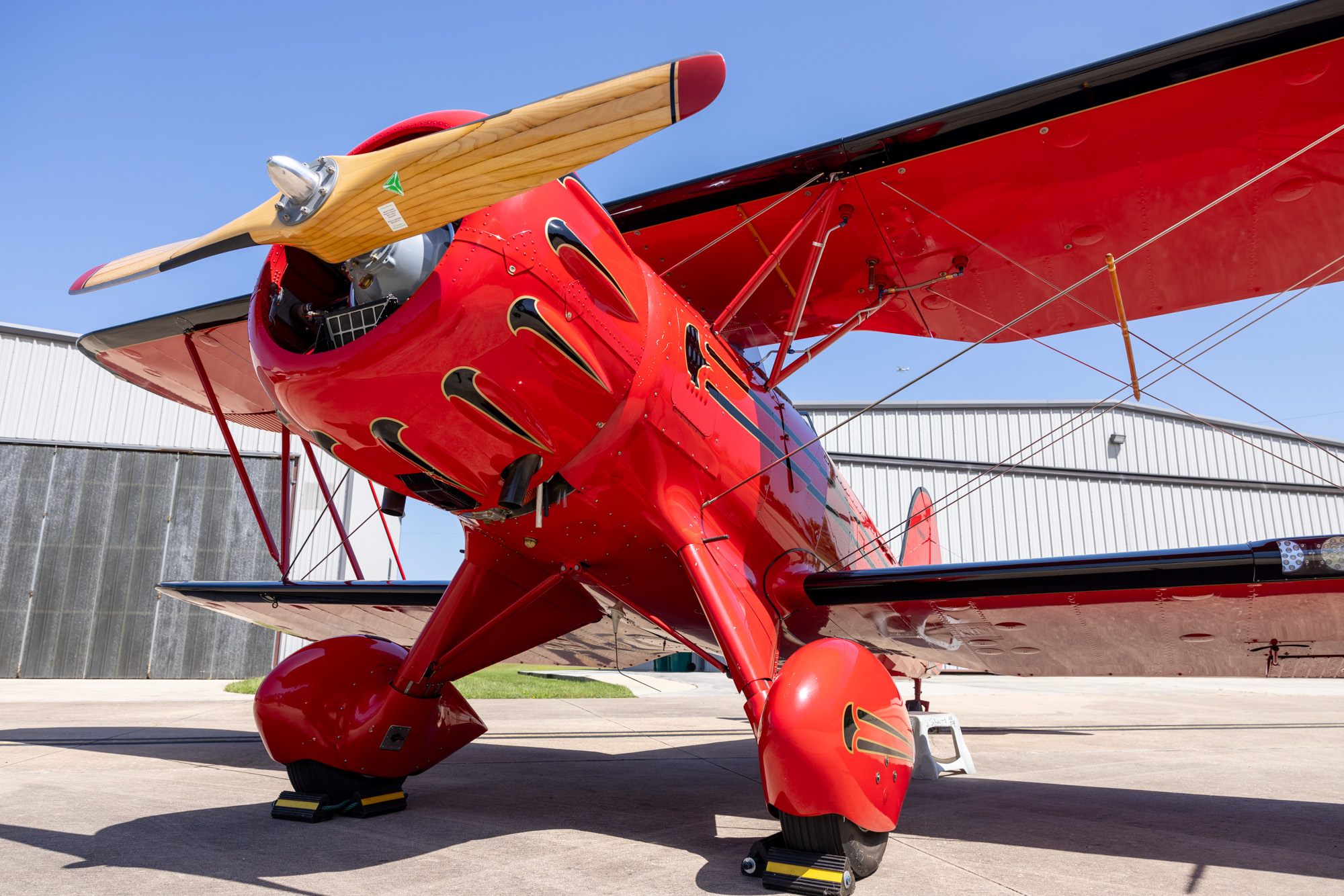 Array of vintage, certificated, and experimental aircraft types on a ramp to illustrate expanded eligibility under MOSAIC