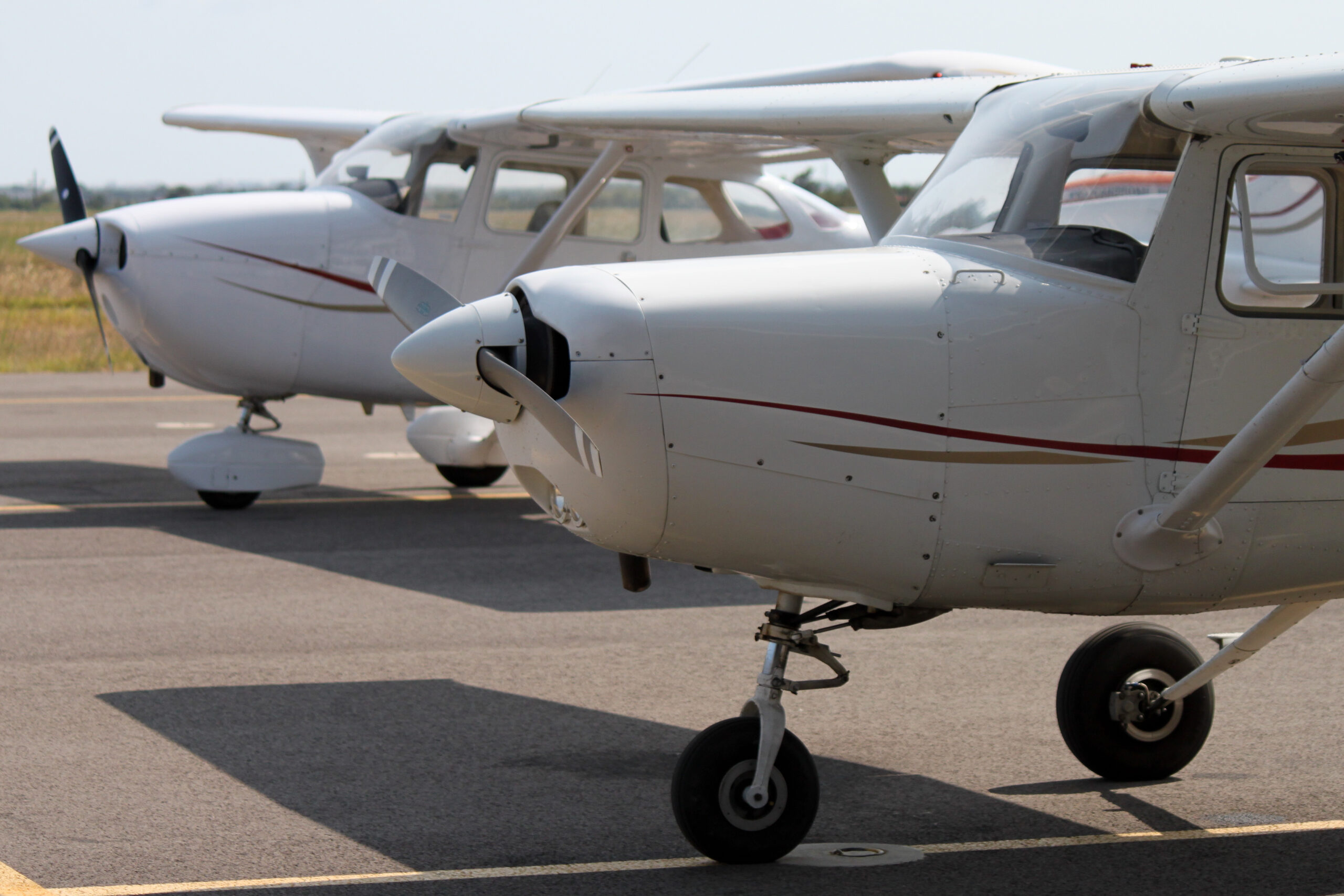 Flight instructor coaching student pilot during landing approach in a small airplane