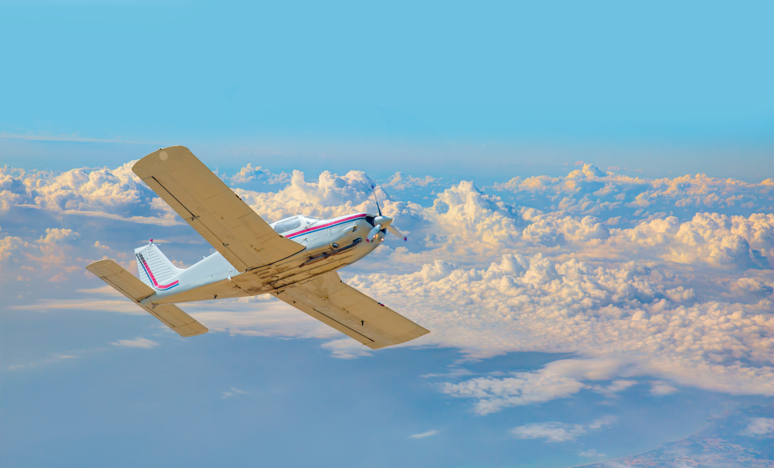 Technicians performing scheduled multi-point maintenance inspection on a light aircraft