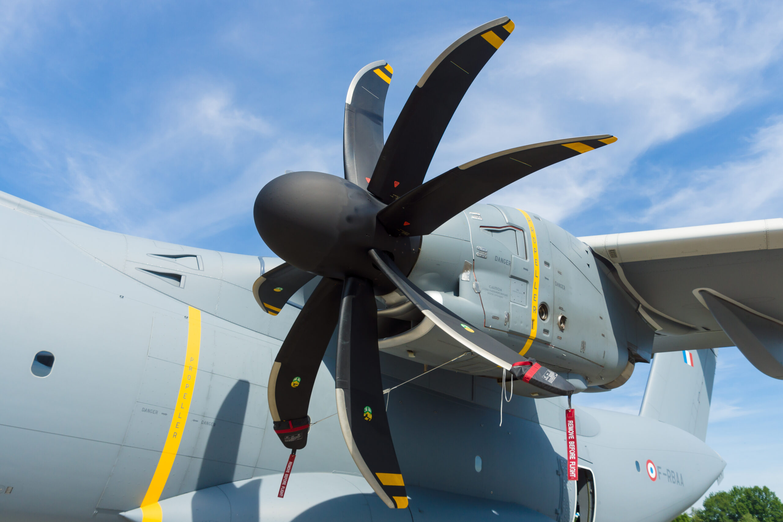 Close-up view of a swept scimitar propeller tip at rest on an aircraft
