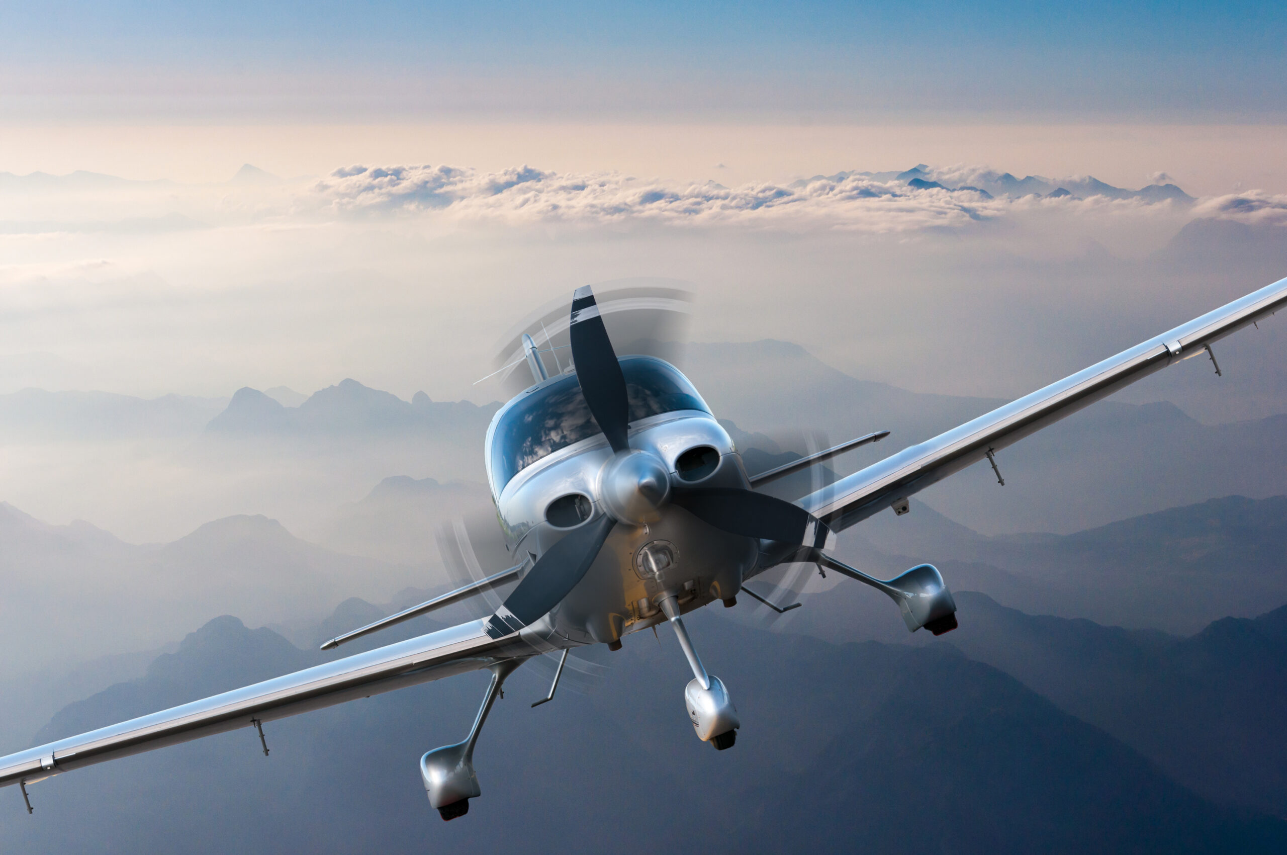 Cessna 172 cruising in straight and level flight over a field