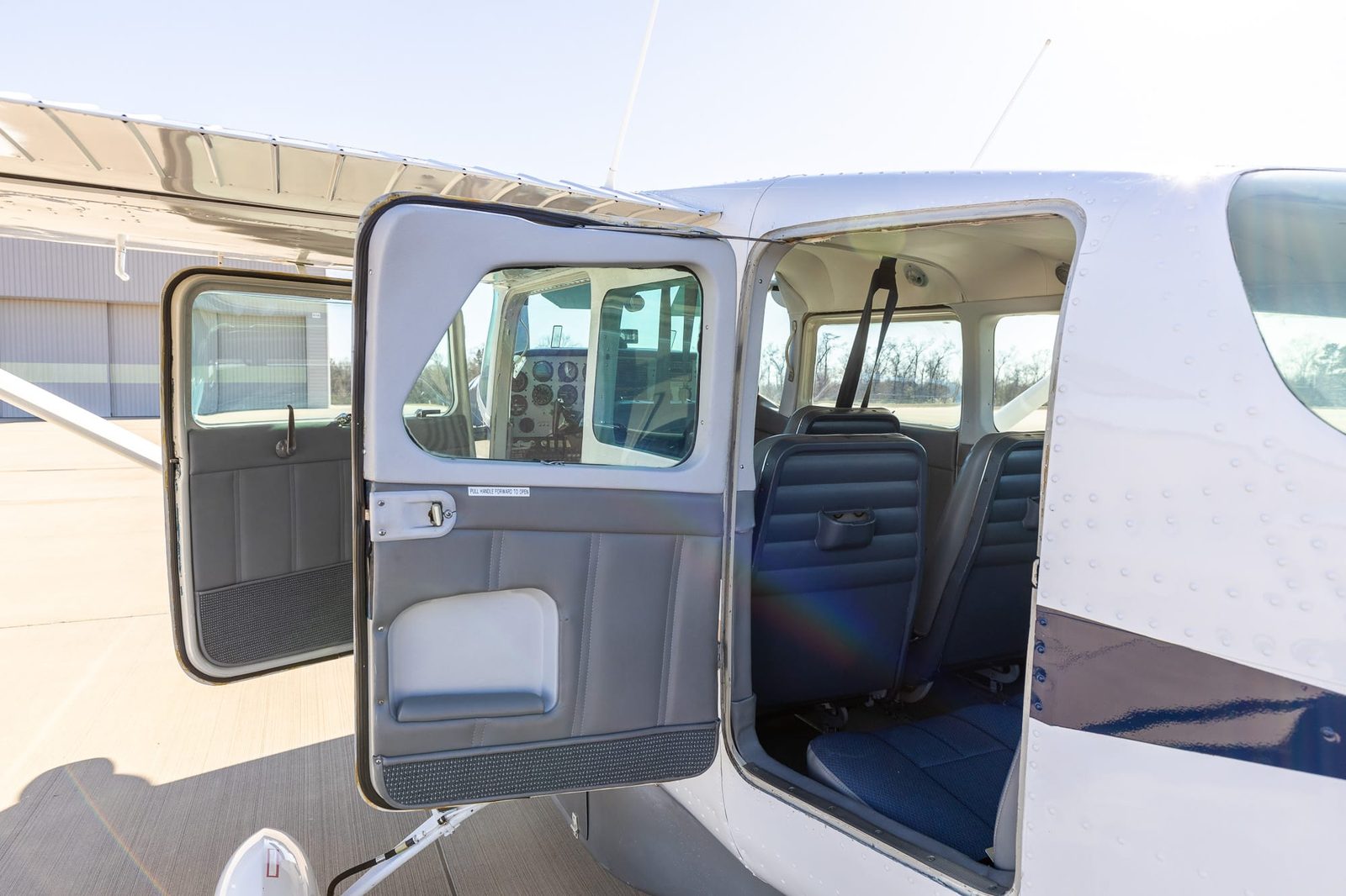 Cessna 206 with the front door and rear double cargo doors open
